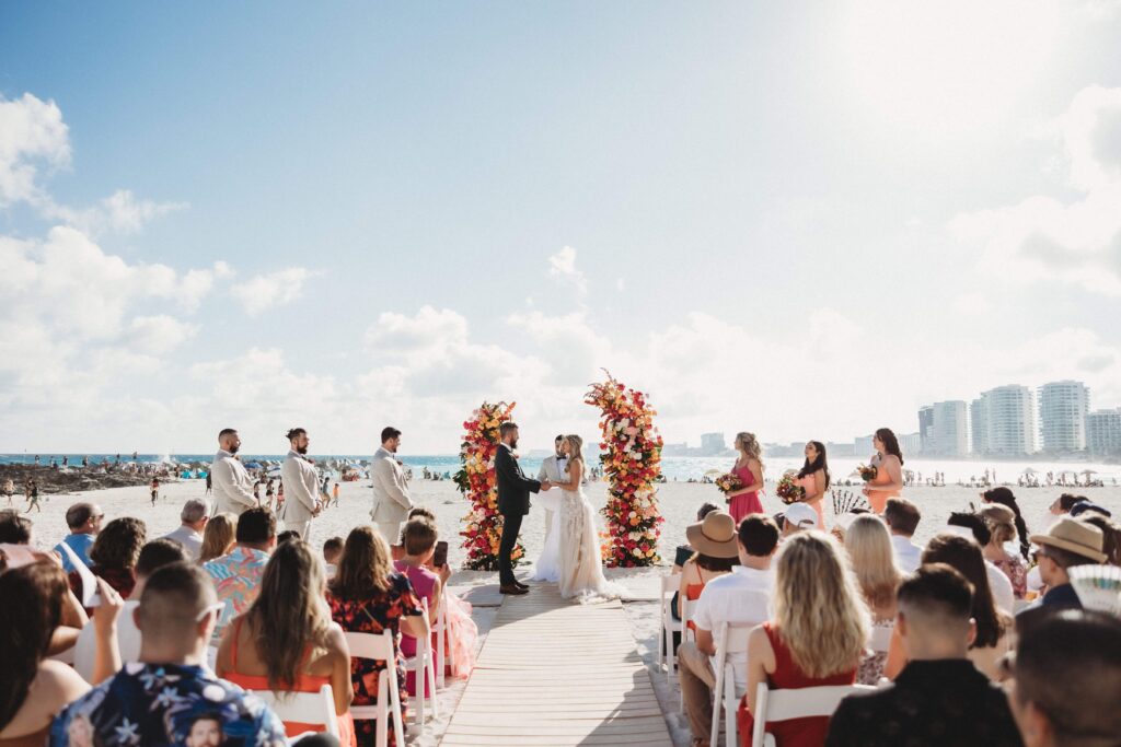 Mallory and James beach destination wedding ceremony photo Hyatt Ziva Cancun