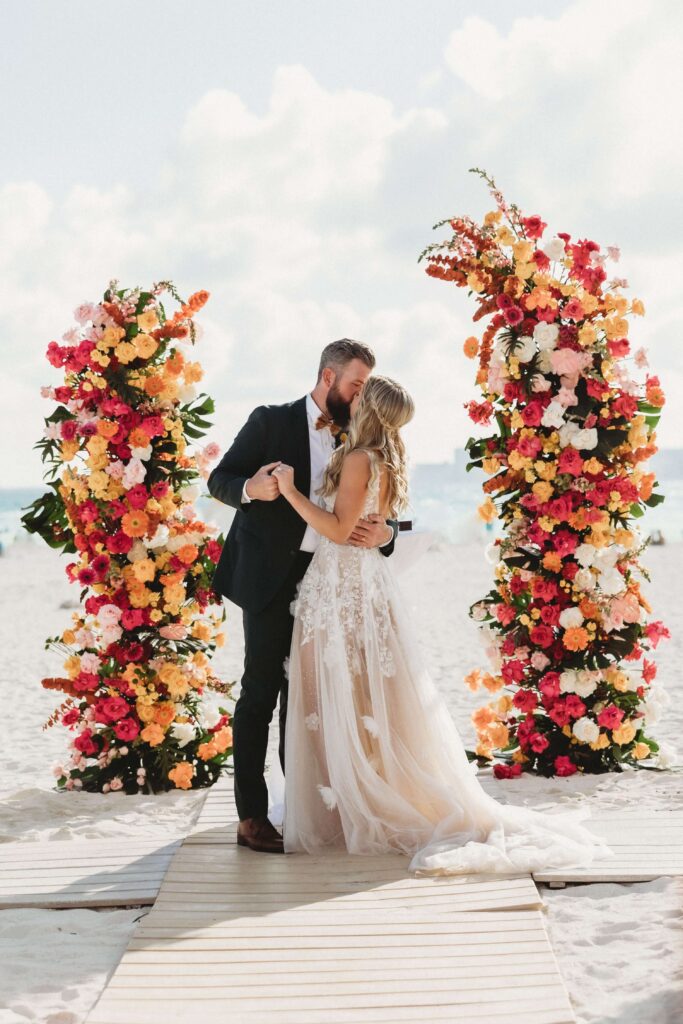 Mallory and James beach destination wedding ceremony photo Hyatt Ziva Cancun