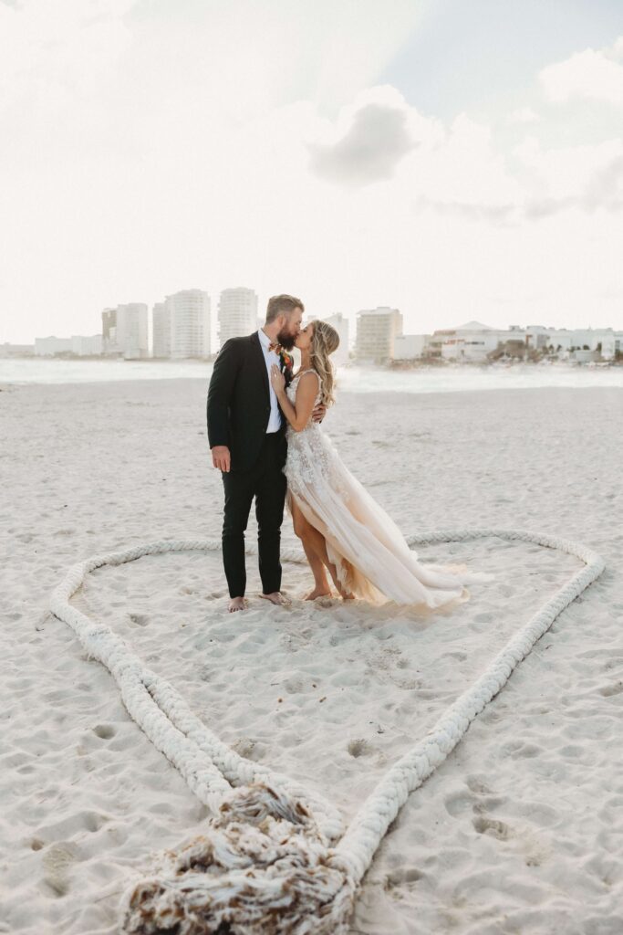 Mallory and James beach destination wedding ceremony photo Hyatt Ziva Cancun