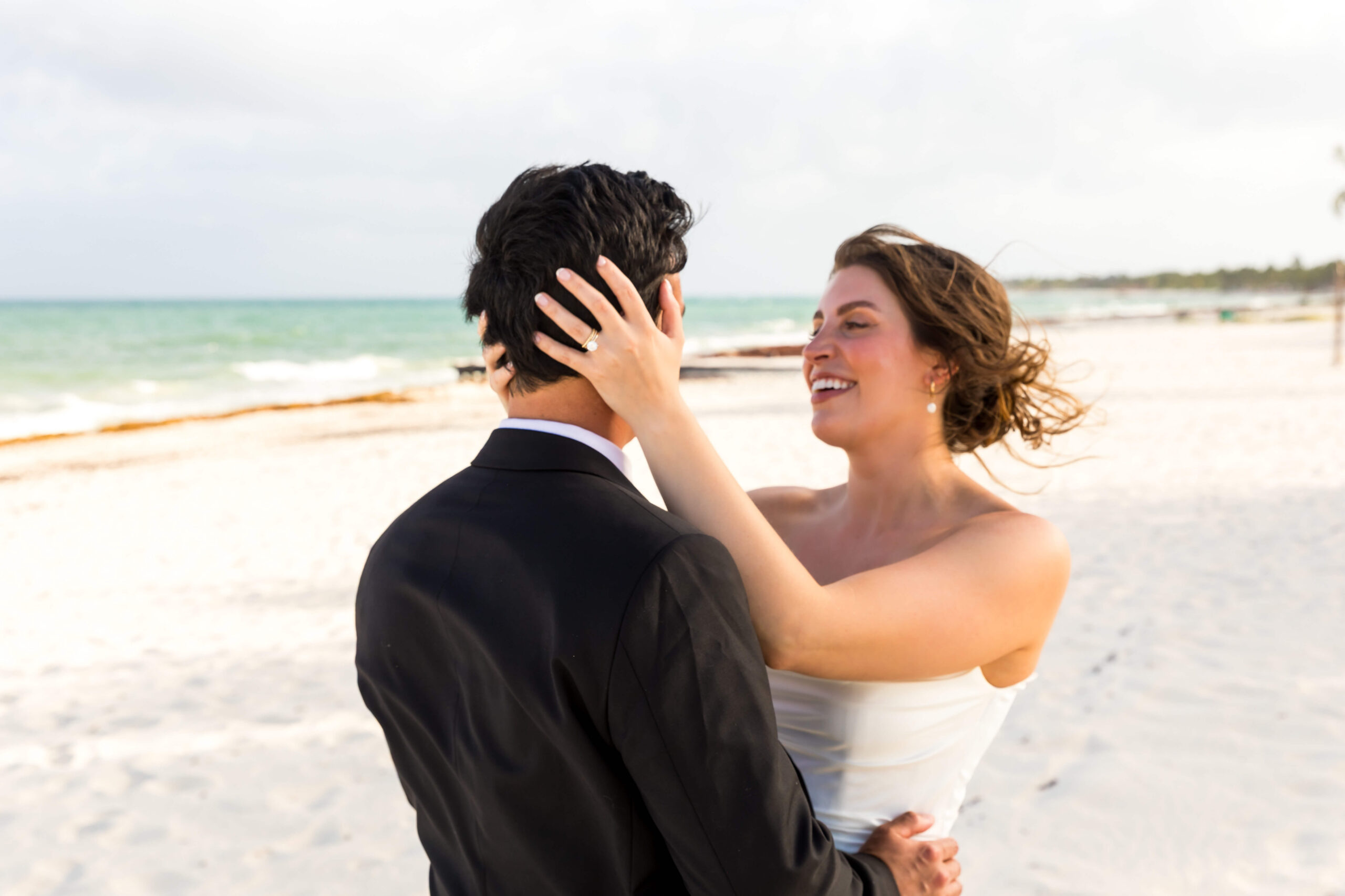 Couple celebrating their destination wedding on the beach